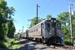 NJT Train # 430, being led by Arrow III Cab Car # 1483 is about to cross the pedestrian path that feeds into Lackawanna Avenue 